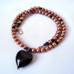 Copper freshwater pearls and black onyx heart pendant necklace by Hortensia Gibbs