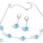 Silver And Blue Topaz Jewelry Set by Rita Sunderland